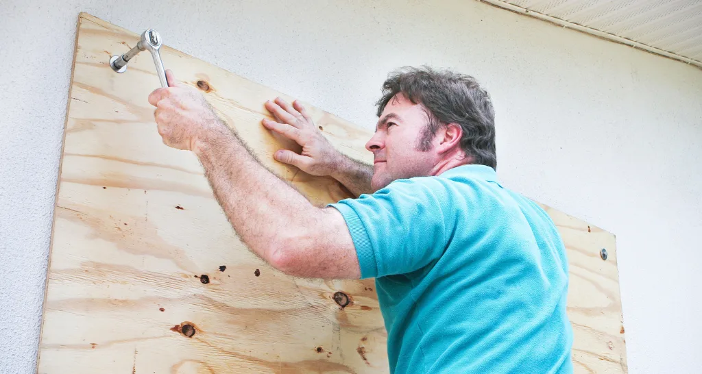 Contractor Performing An Emergency Window Boarding Service For a Home in Kent, WA