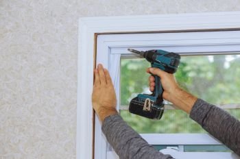 Contractor Performing Residential Window Repair at a Home in Seattle, WA