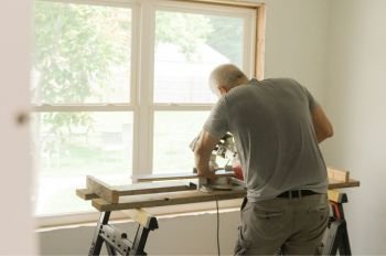 Contractor performing a residential window repair in Bellevue, WA
